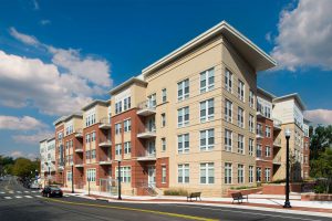 Exterior view of a multi-story residential building with a modern design.