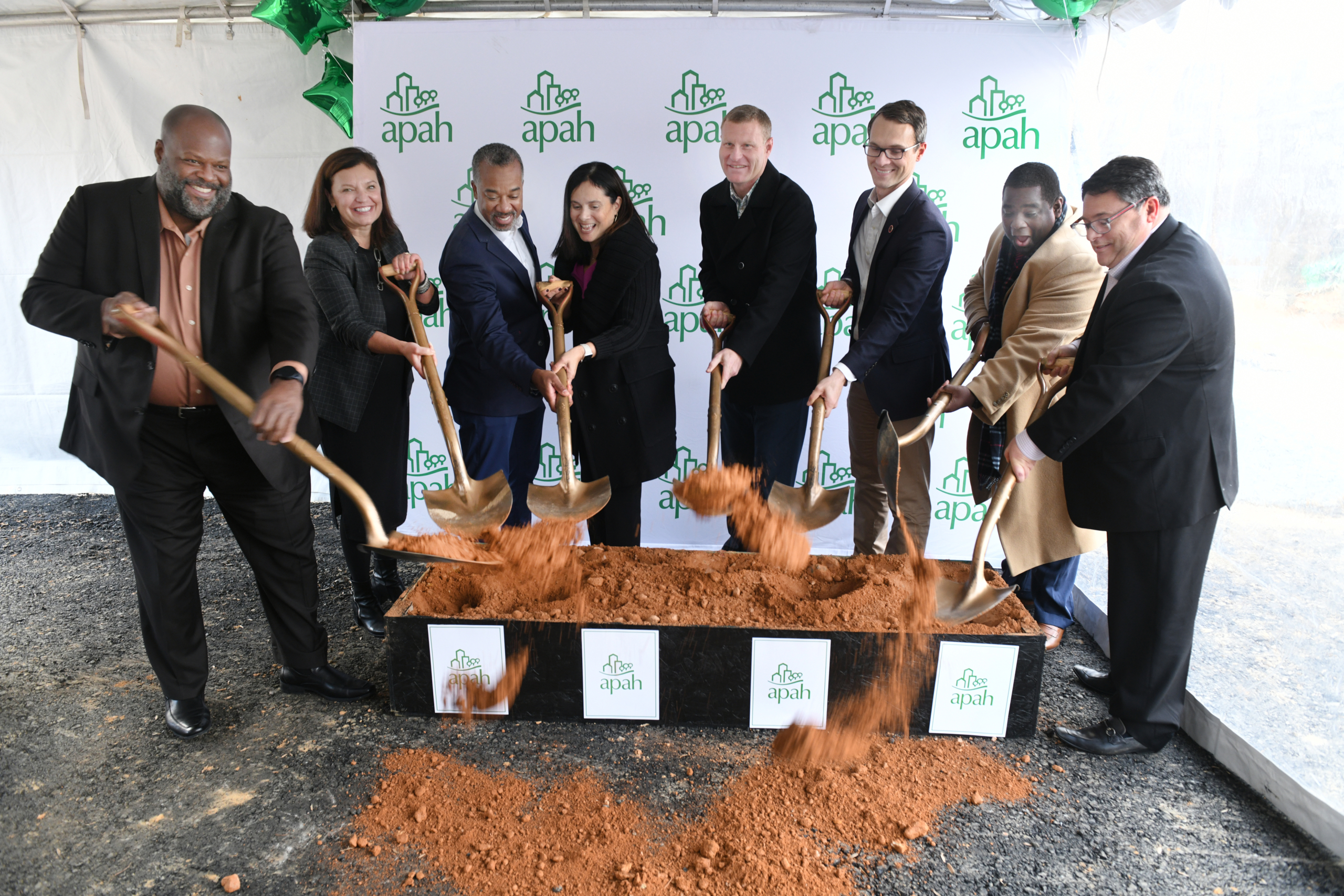 Speakers at the event celebrate the start of Braddock Senior’s construction. From left to right: Jimmie Jones, Jill Norcross, Rich Jordan, Carmen Romero, Jeffrey McKay, James Walkinshaw, Broderick Dunn, Scott Gensler.