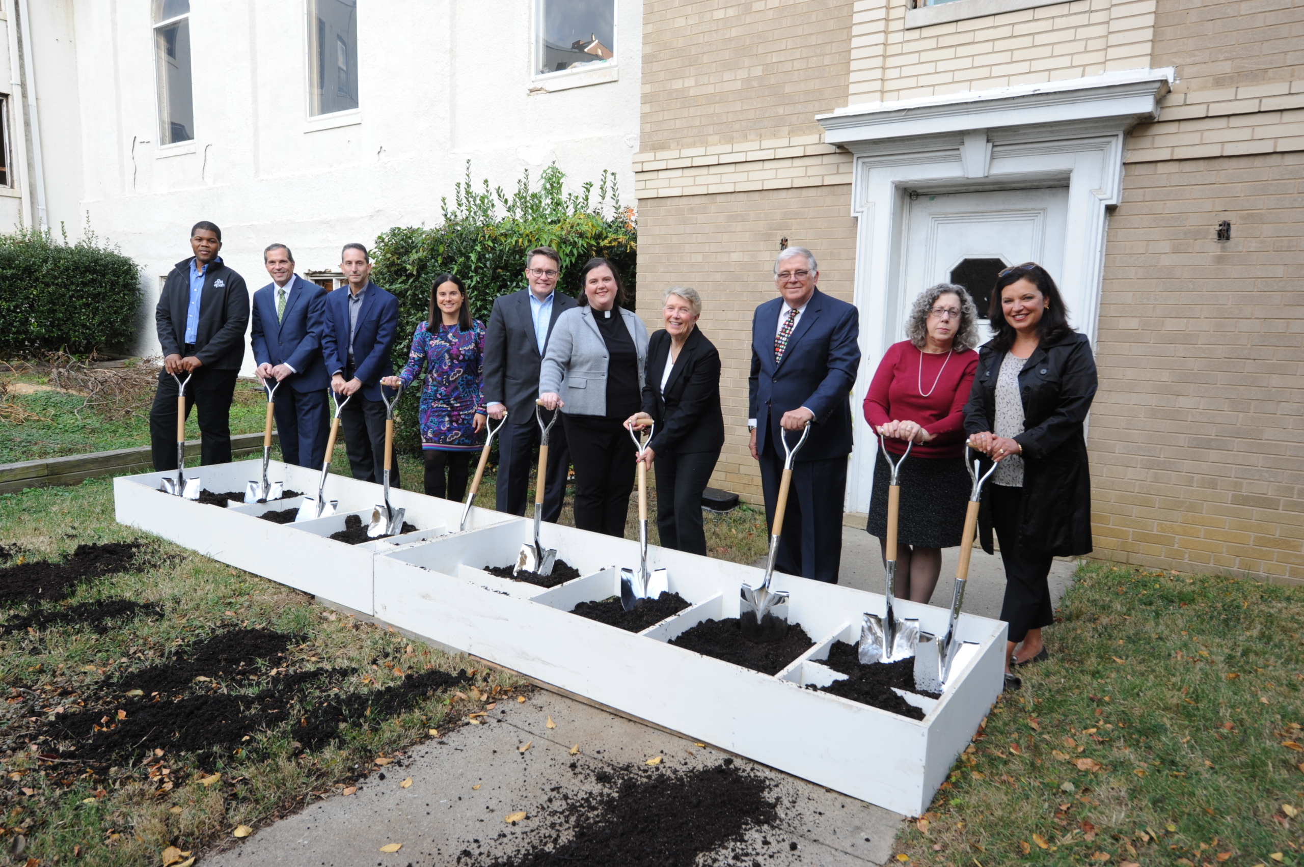 Partners stand with shovels at the ceremonial groundbreaking of Ballston Station