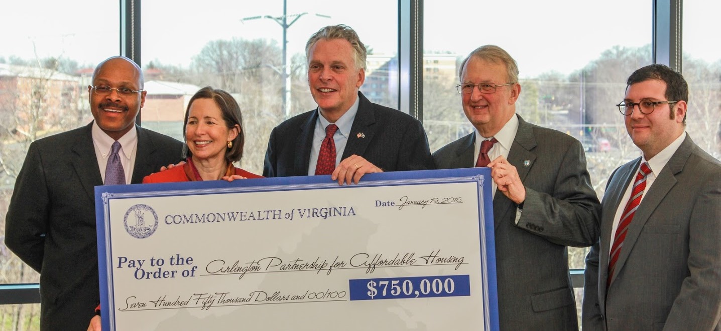 Group photo with a large check for $750,000 donation to Arlington Partnership for Affordable Housing.