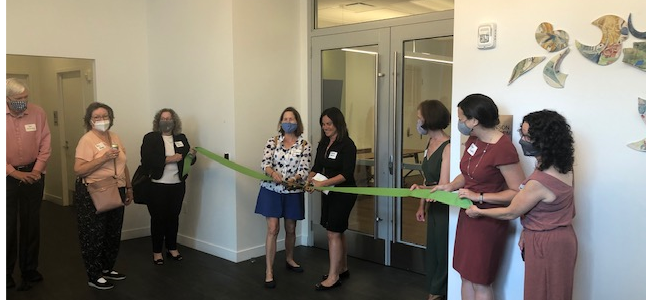 Cutting the ribbon at Johnson Event