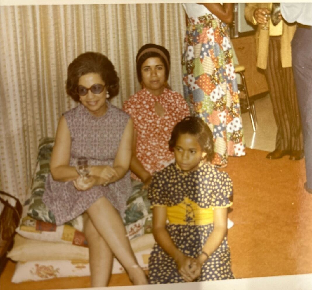 Old photograph showing two women and a girl.