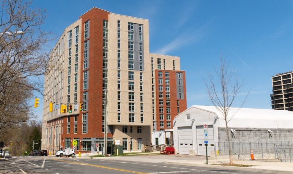 Photograph of a brown and beige building