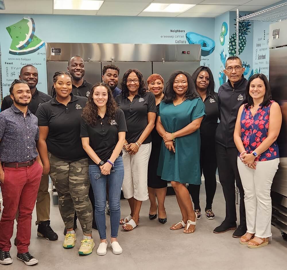 Professional team smiling together in a room