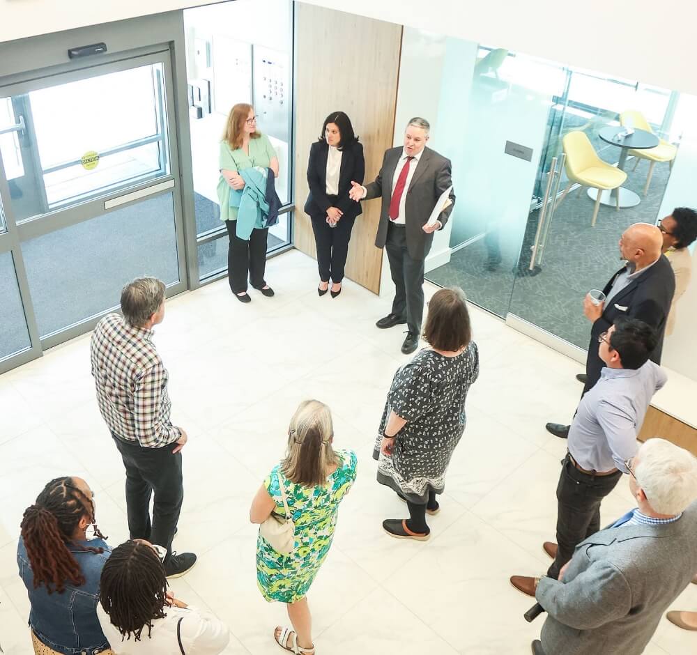 Group of people having a discussion in a building lobby