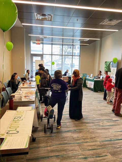 Participants interacting at a booth.