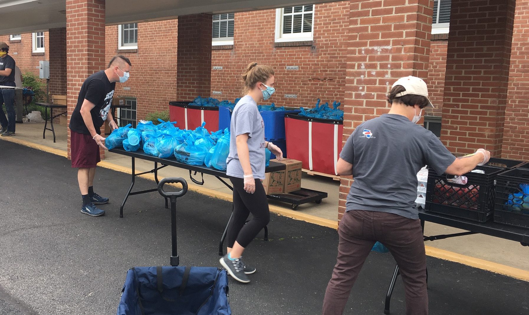 Three volunteers, donations on the tables